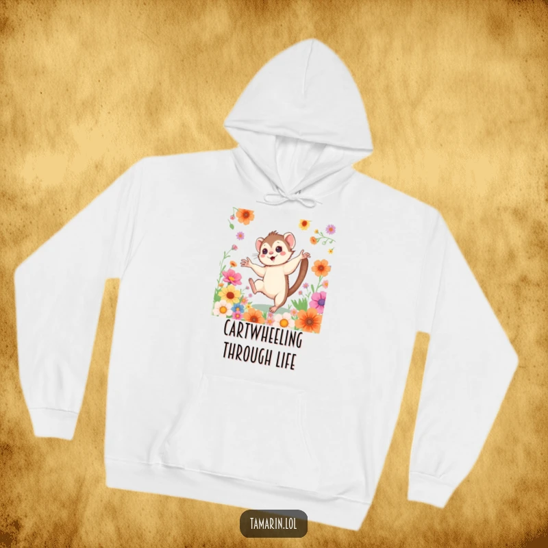 Funny Cartwheeling Tamarin Hoodie: A warm sweatshirt featuring a happy monkey doing a cartwheel among vibrant flowers, embodying energetic cheerfulness.