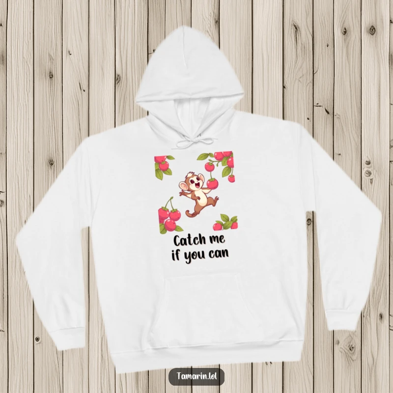 Funny hoodie featuring a dynamic tamarin character leaping with excitement to grab a radiant berry, a perfect depiction of energetic fun for screen readers.