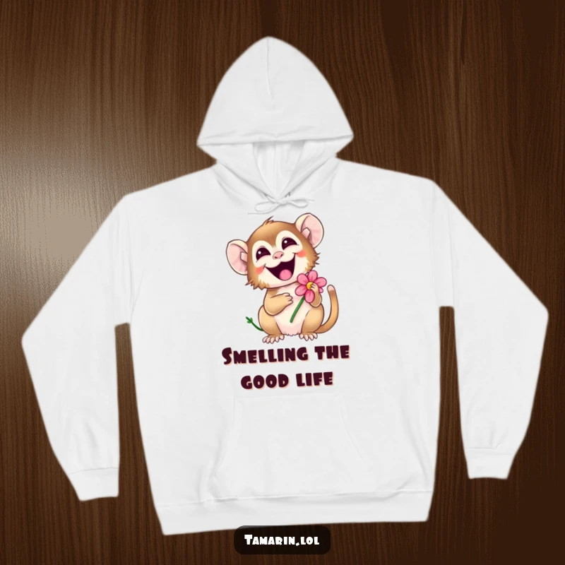 Funny tamarin hoodie with a happy monkey giggling joyously, holding a colorful flower, perfect for spreading warmth and smiles.