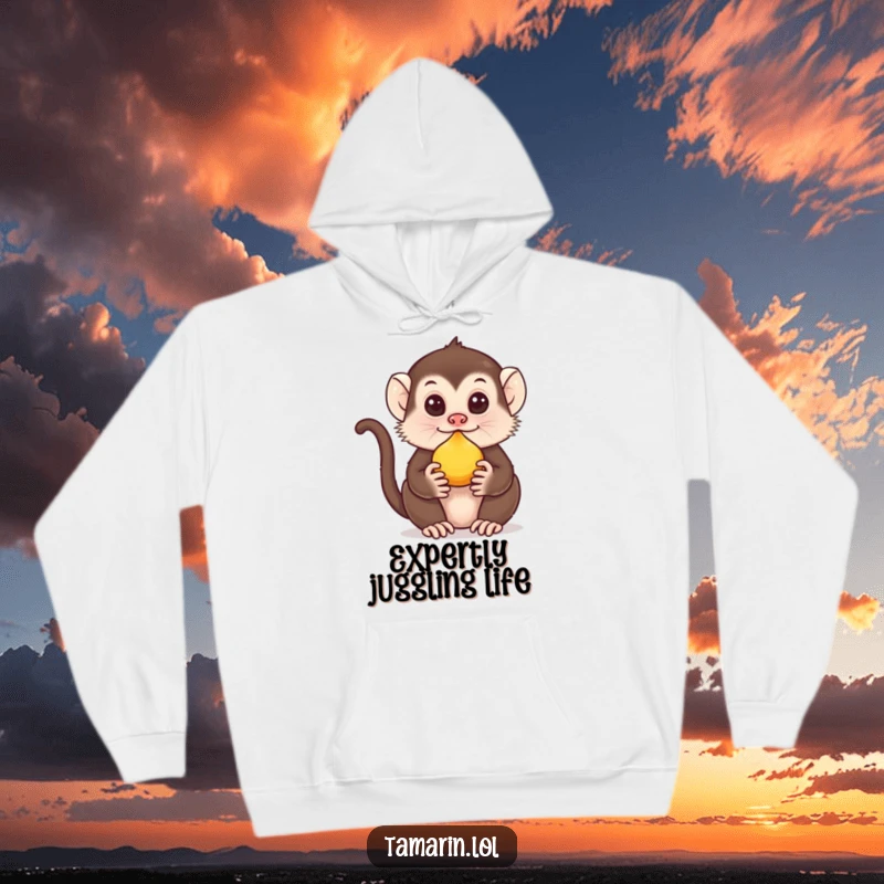 Funny Tamarin Hoodie: A cute tamarin balances fruit on its nose, offering cozy comfort and a humorous design.