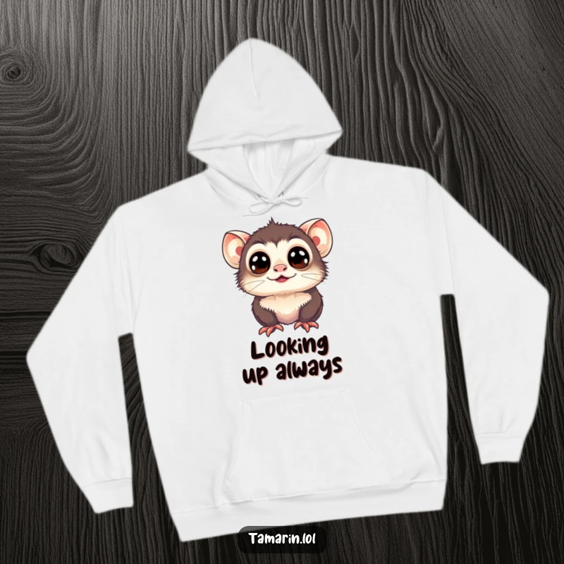 Funny Tamarin Hoodie: A tamarin with wide, happy eyes looks up, offering cozy comfort and cheerful vibes.