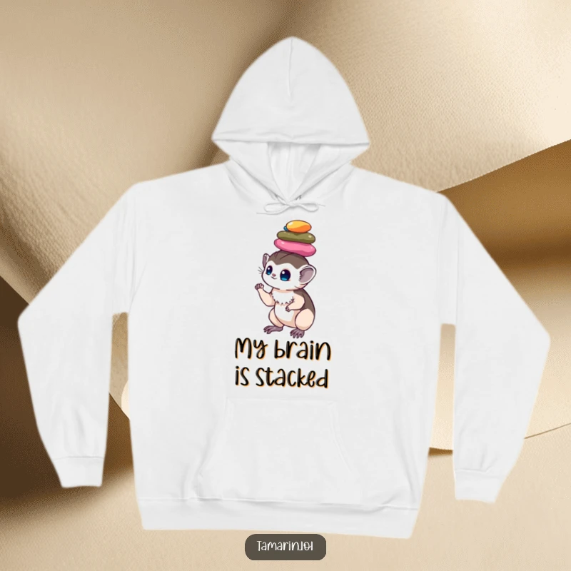 Funny tamarin hoodie: a comfortable hoodie featuring a monkey masterfully balancing a pile of colorful, shiny pebbles on its head, radiating calm.