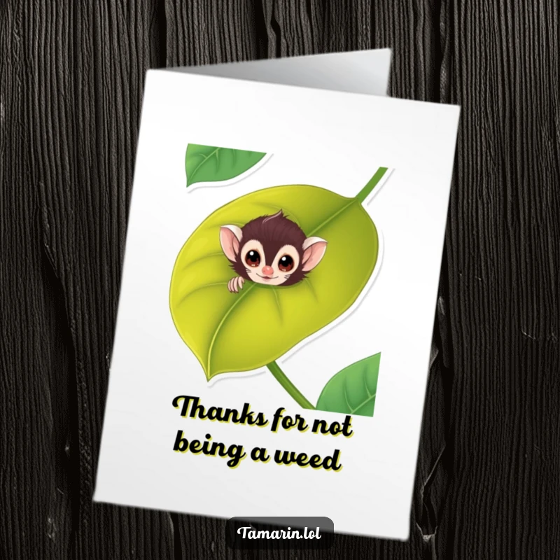 Funny Free Printable Tamarin Thank You Card: A cute tamarin peeks from behind a large leaf, conveying thanks with a playful spirit.