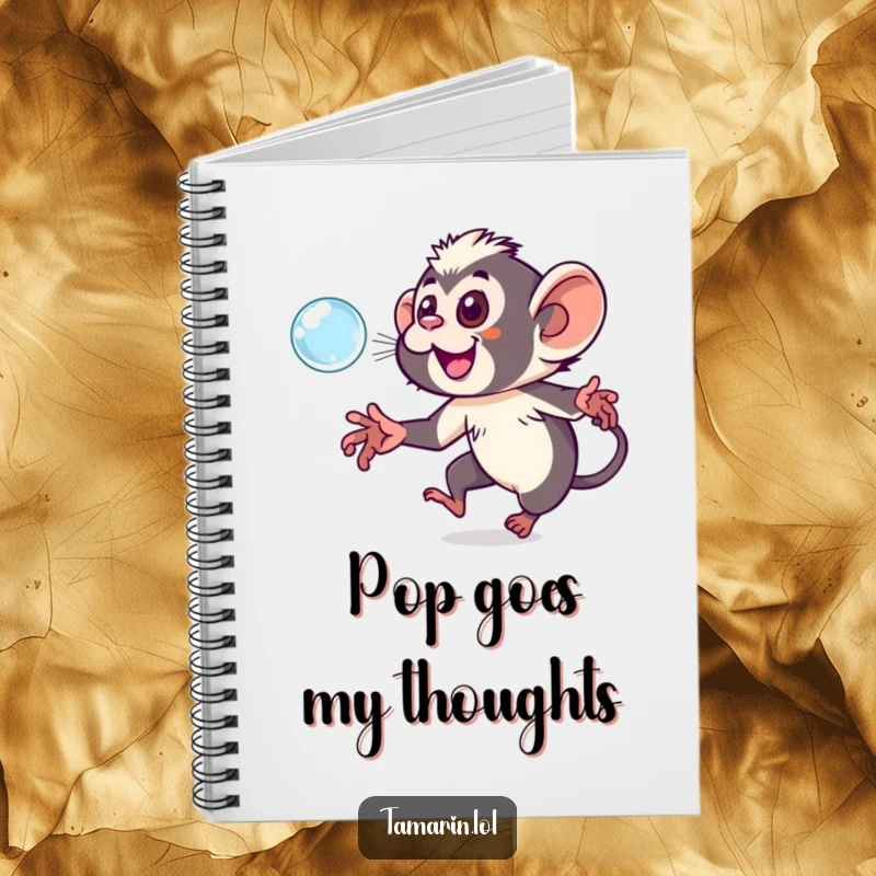 Funny tamarin notebook featuring a playful monkey chasing a sparkling bubble, ideal for notes and creative ideas.