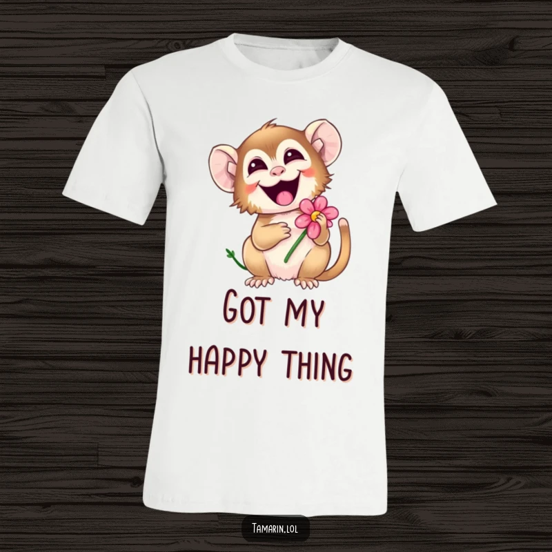 Funny tamarin t-shirt showing a playful monkey giggling joyfully while holding a pretty flower, a symbol of happiness.